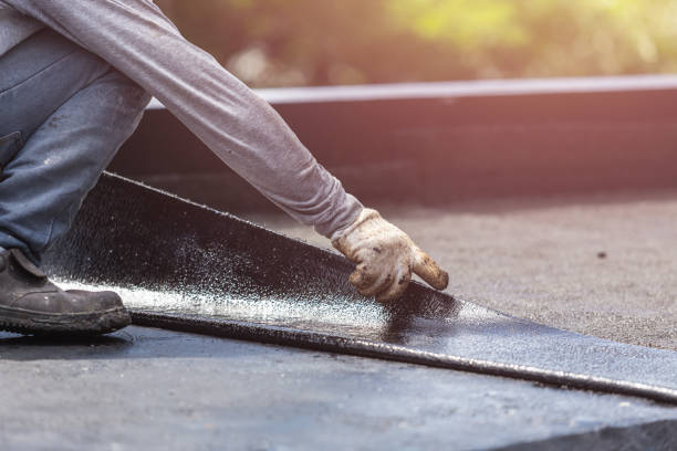 Professional Basement Waterproofing technician working in Butlerville, IN